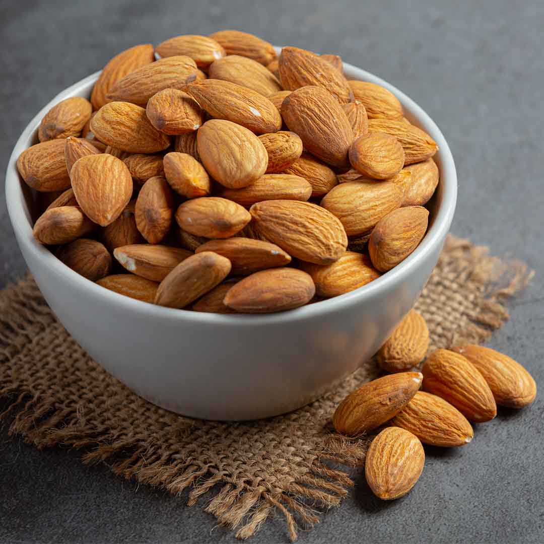Bowl of almonds used to make almond oil in bulk by Sri Venkatesh Aromas (SVA Naturals)