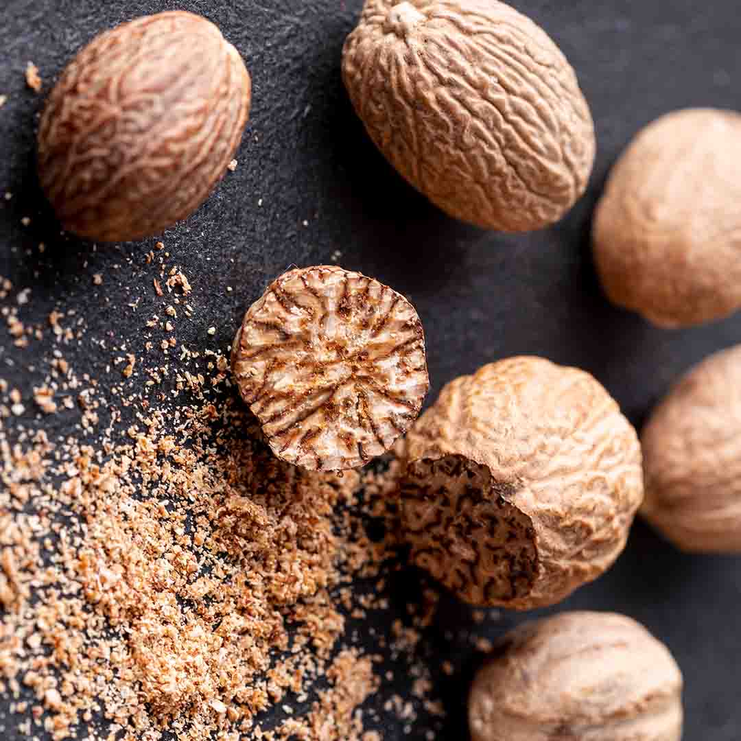 Seeds of Nutmeg tree, which are used to extract Nutmeg essential oil in bulk and wholesale prices